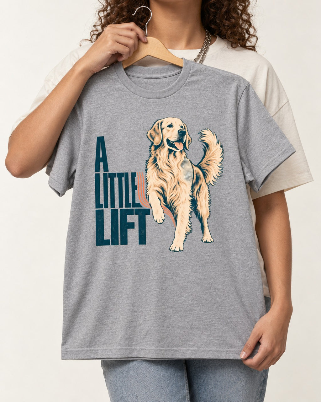 A Little Lift Golden Retriever T-Shirt in Sport Grey, held up on a hanger