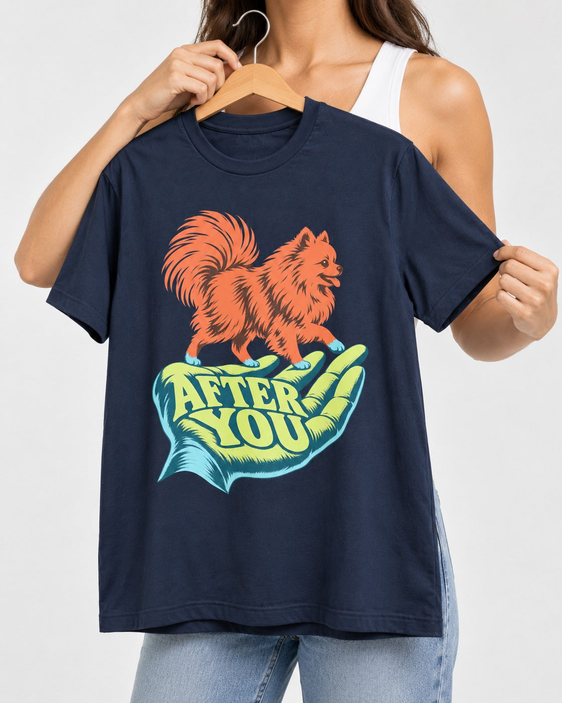 Pomeranian After You Helping Hand Graphic T-Shirt in Navy, held up on a hanger