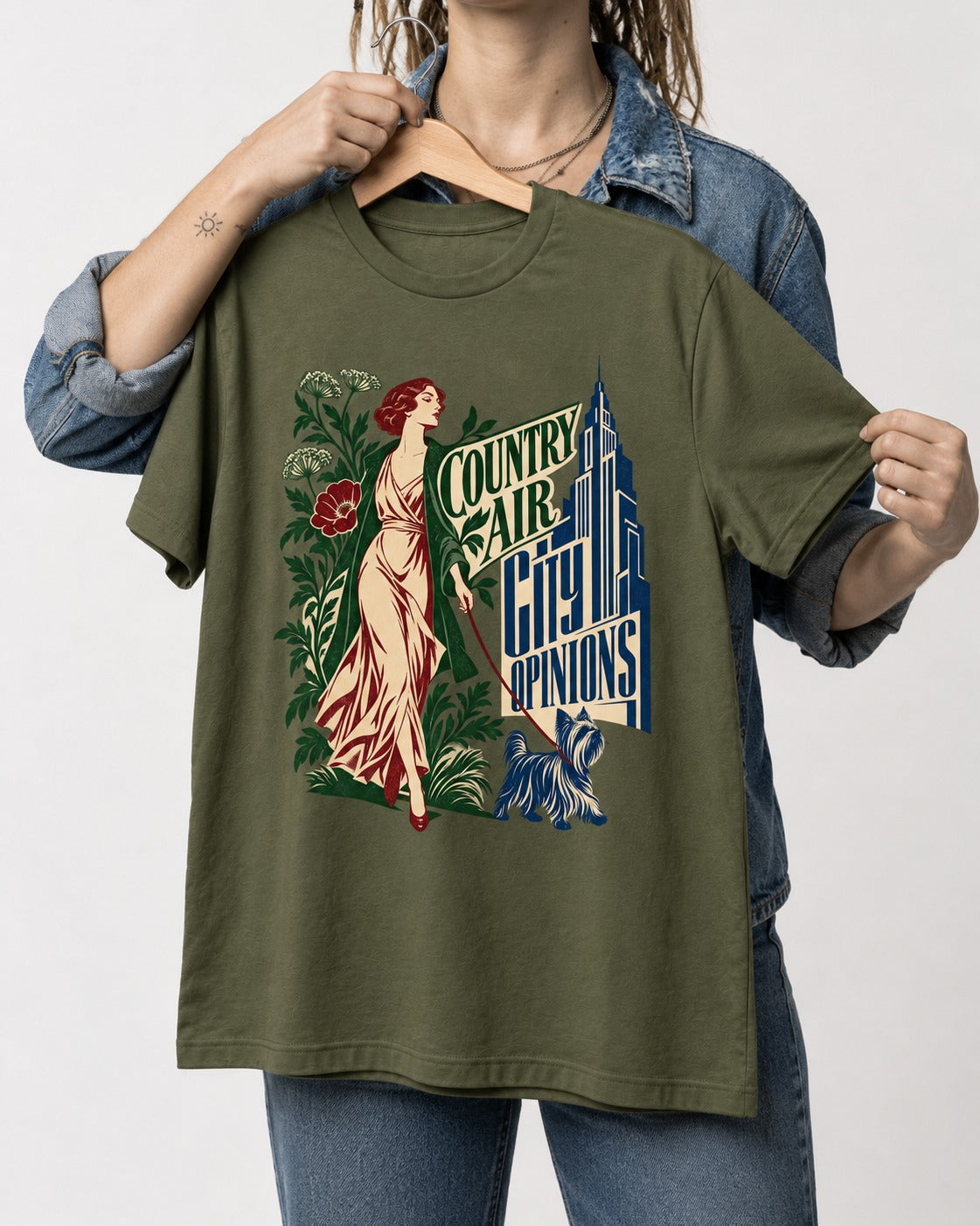 Yorkshire Terrier Country Air City Opinions Botanical Graphic T-Shirt in Heather Military Green, held up on a hanger