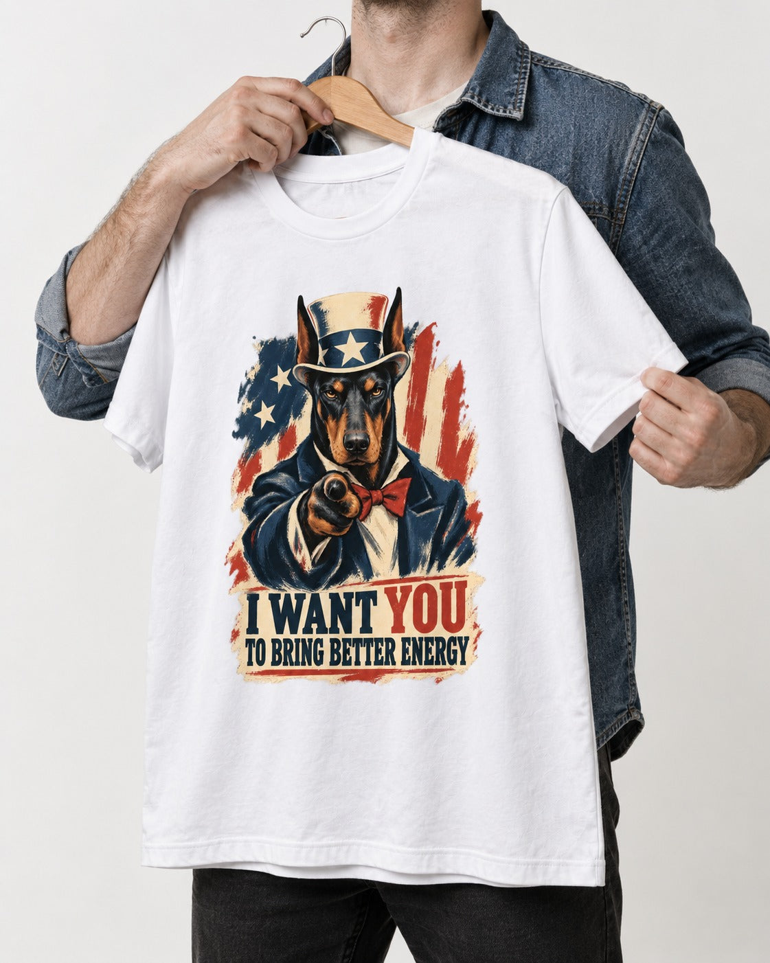 Doberman I Want You to Bring Better Energy Uncle Sam Graphic T-Shirt in White, held up on a hanger