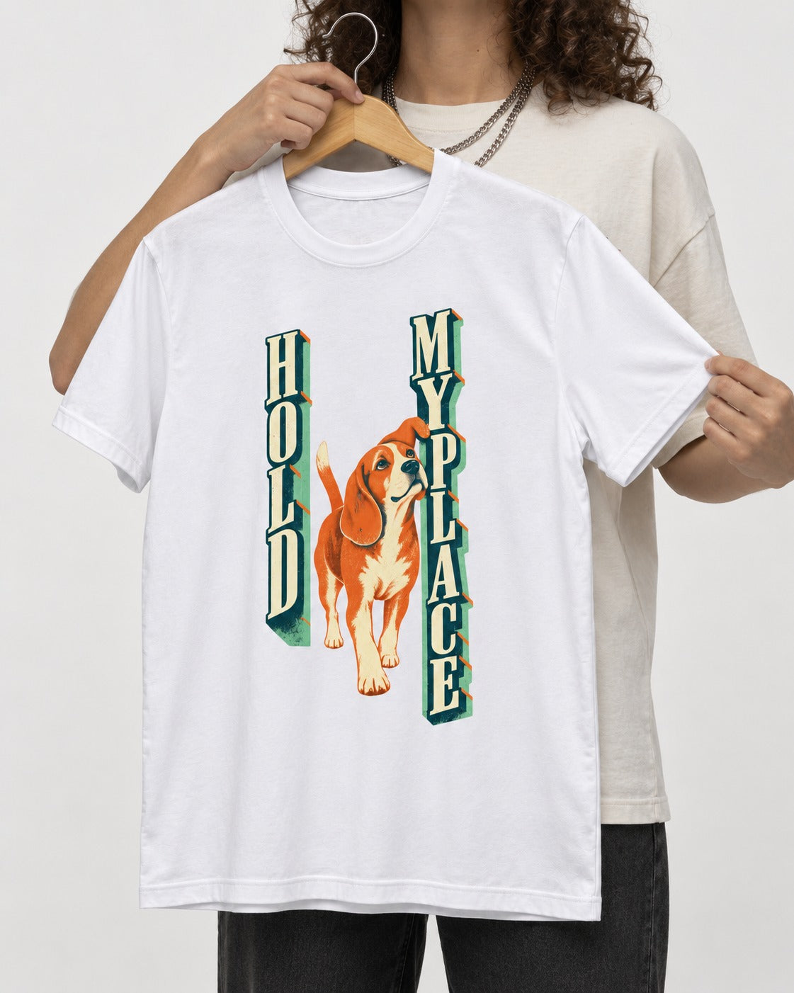 Vintage Beagle Hold My Place T-Shirt in White, held up on a hanger