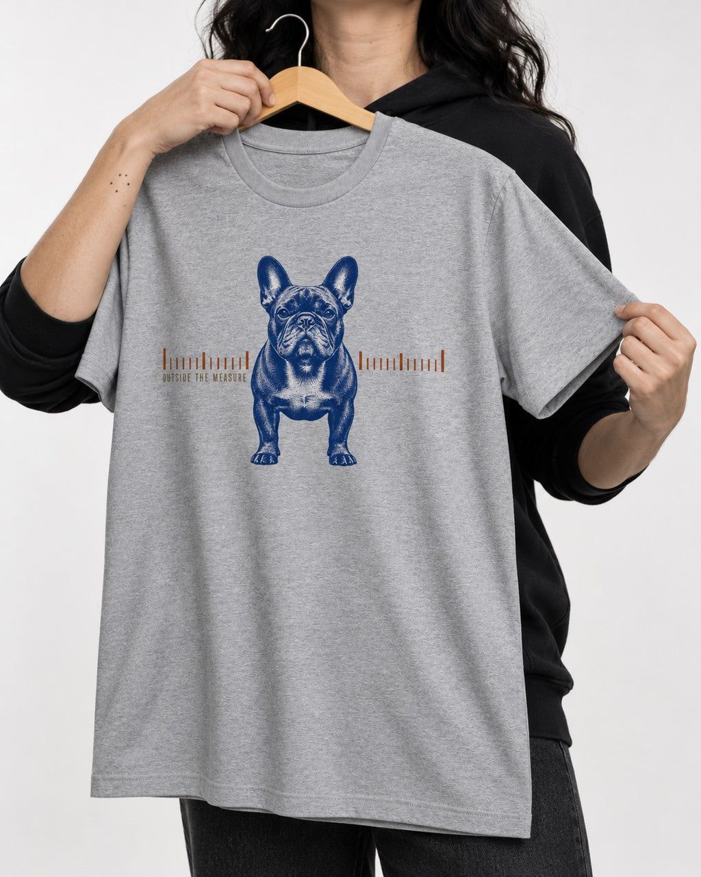 Frenchie Outside the Measure T-Shirt in Sport Grey, held up on a hanger