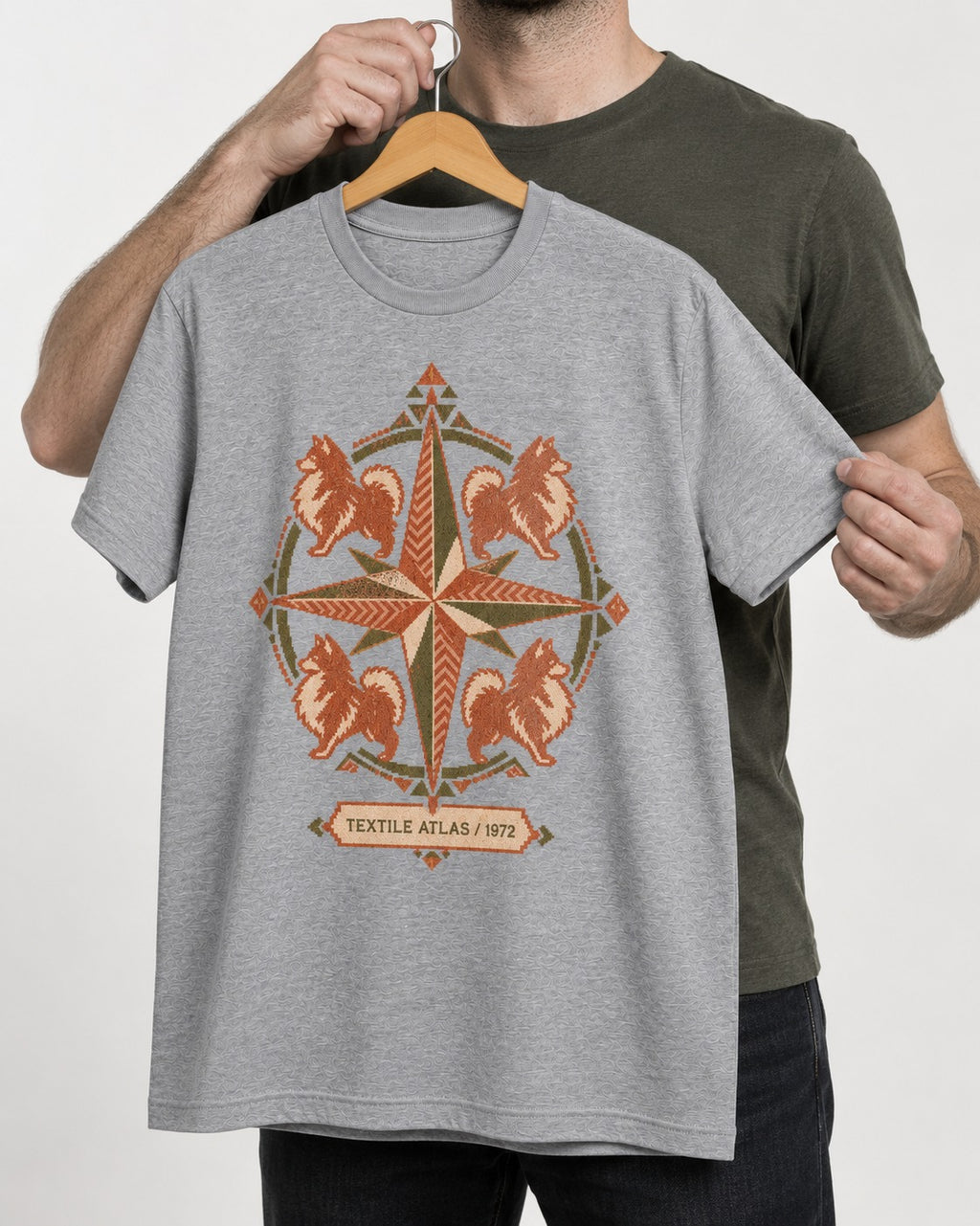 Pomeranian Textile Atlas Compass Rose Graphic T-Shirt in Sport Grey, held up on a hanger