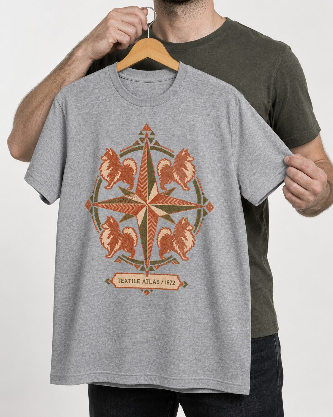 Pomeranian Textile Atlas Compass Rose Graphic T-Shirt in Sport Grey, held up on a hanger