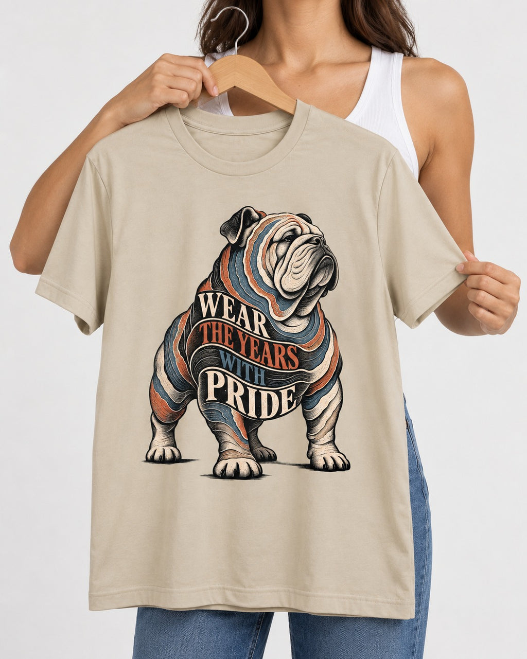 English Bulldog Wear the Years T-Shirt in Sand, held up on a hanger