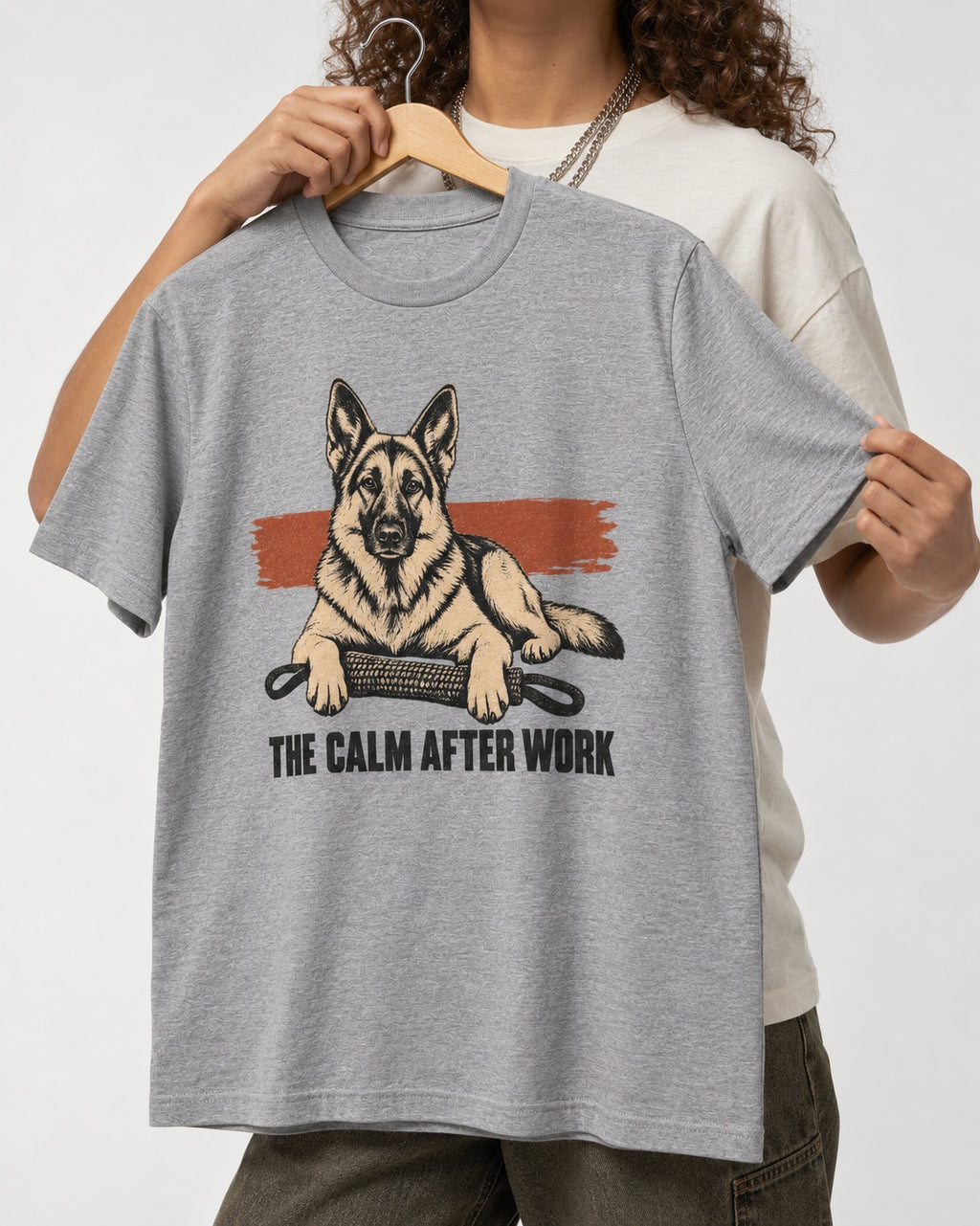 German Shepherd Dog The Calm After Work T-Shirt in Sport Grey, held up on a hanger
