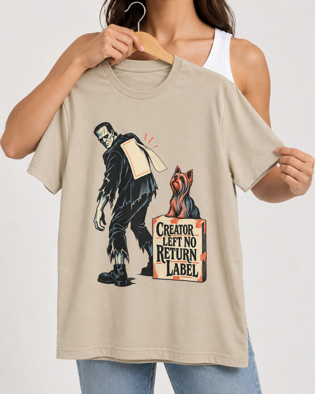 No Return Label Yorkshire Terrier T-Shirt in Sand, held up on a hanger