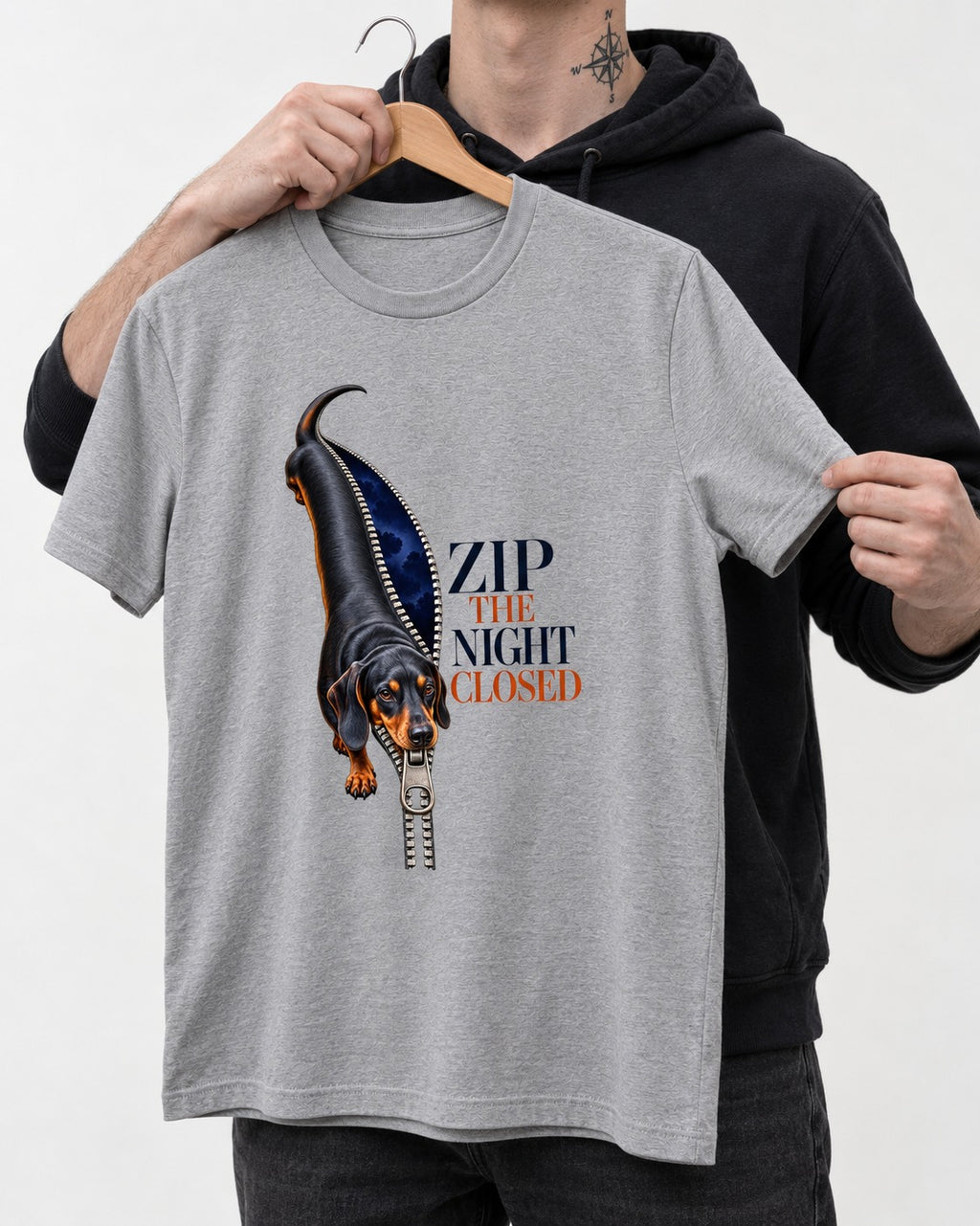 Zip the Night Closed Dachshund T-Shirt in Sport Grey, held up on a hanger