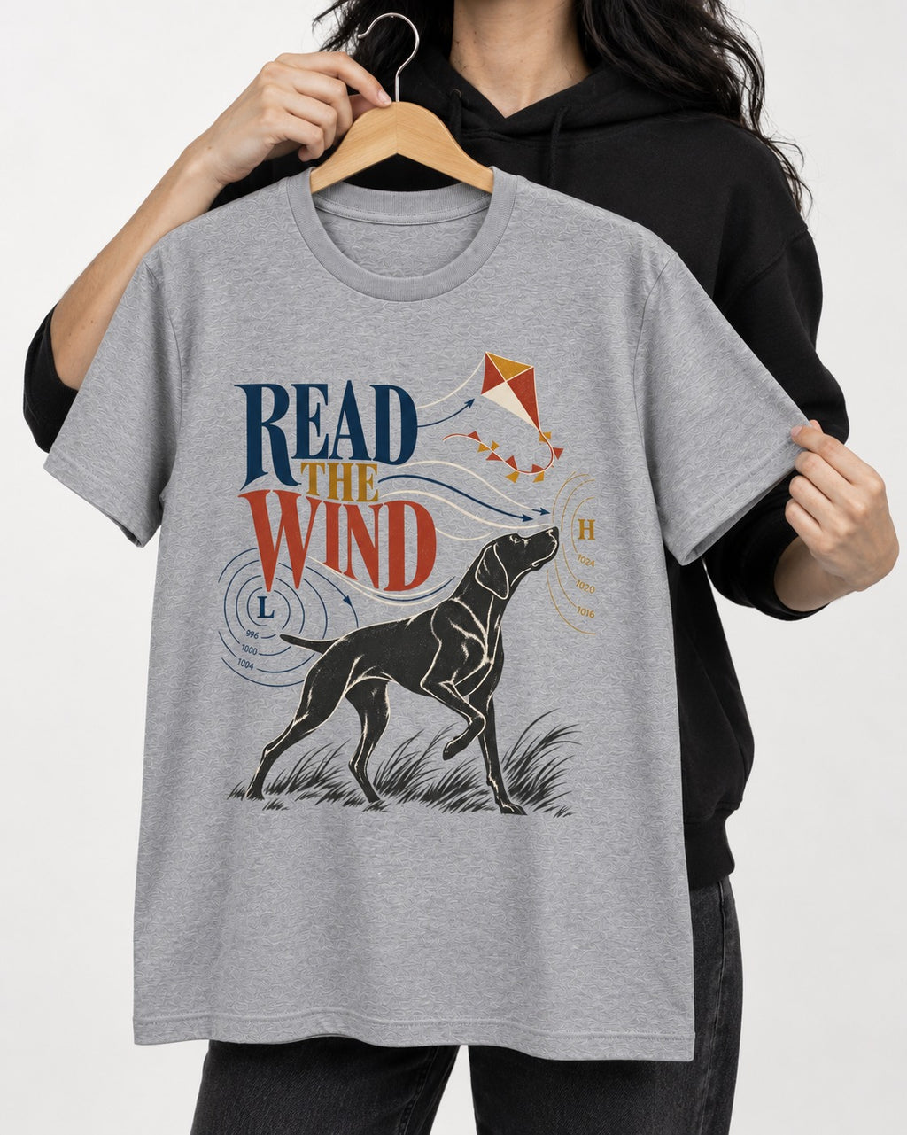 Read the Wind German Shorthaired Pointer T-Shirt in Sport Grey, held up on a hanger