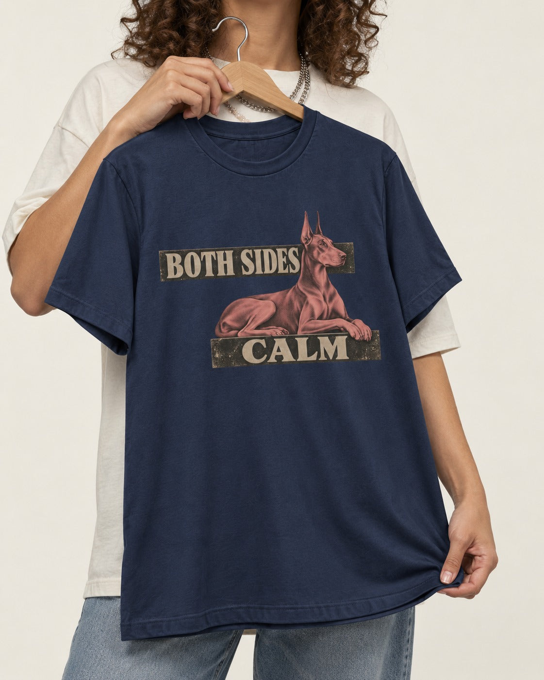 Doberman Both Sides Calm Banner T-Shirt in Navy, held up on a hanger