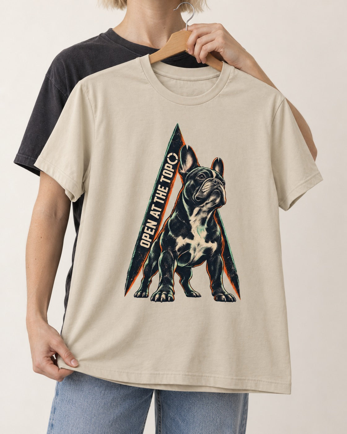 Frenchie Open at the Top T-Shirt in Sand, held up on a hanger
