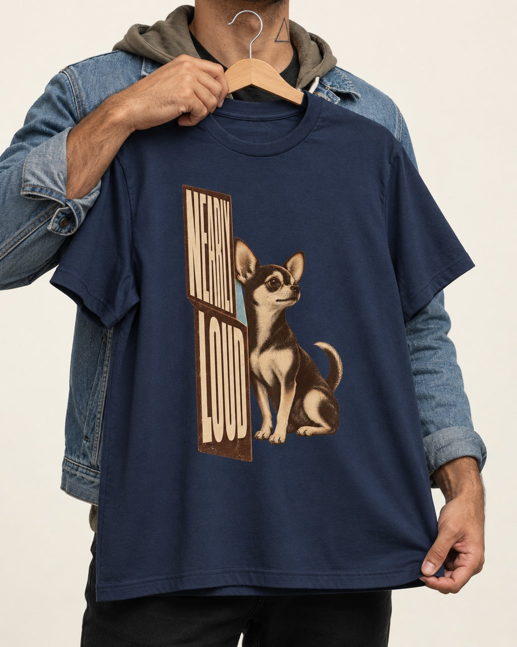 Chihuahua Never Loud T-Shirt in Navy, held up on a hanger