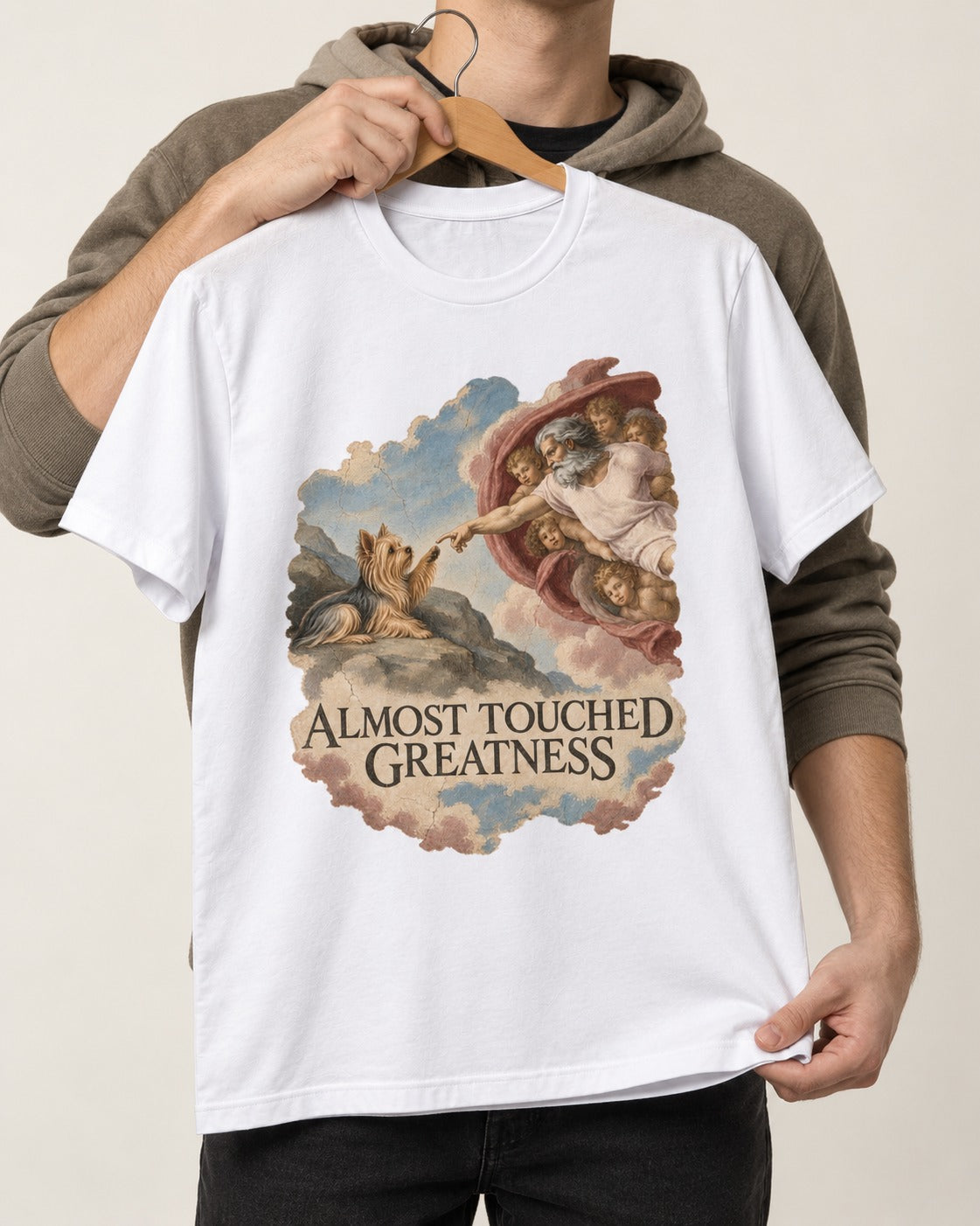 Yorkshire Terrier Almost Touched Greatness Creation Parody Graphic T-Shirt in White, held up on a hanger
