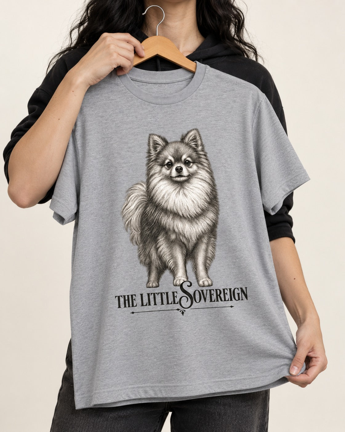 The Little Sovereign Pomeranian T-Shirt in Sport Grey, held up on a hanger