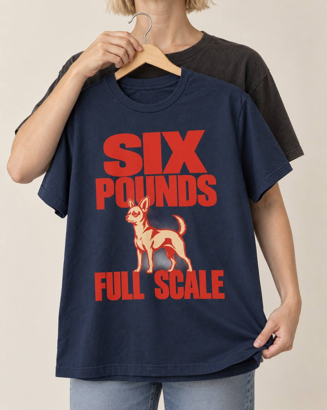 Chihuahua Six Pounds Full Scale Typographic Graphic T-Shirt in Navy, held up on a hanger