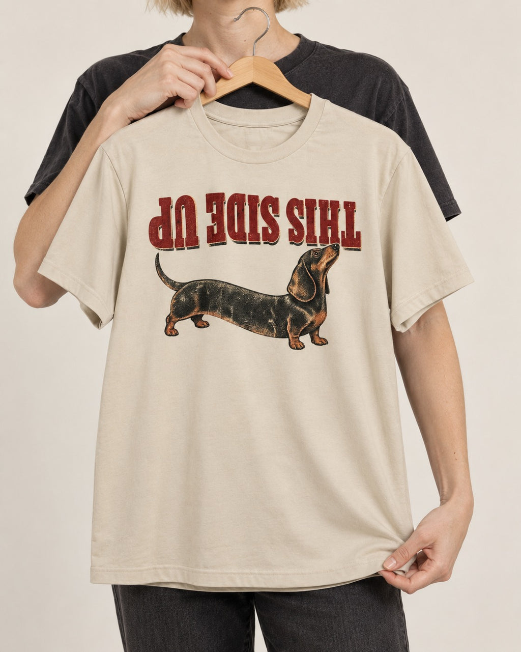 This Side Up Dachshund T-Shirt in Sand, held up on a hanger