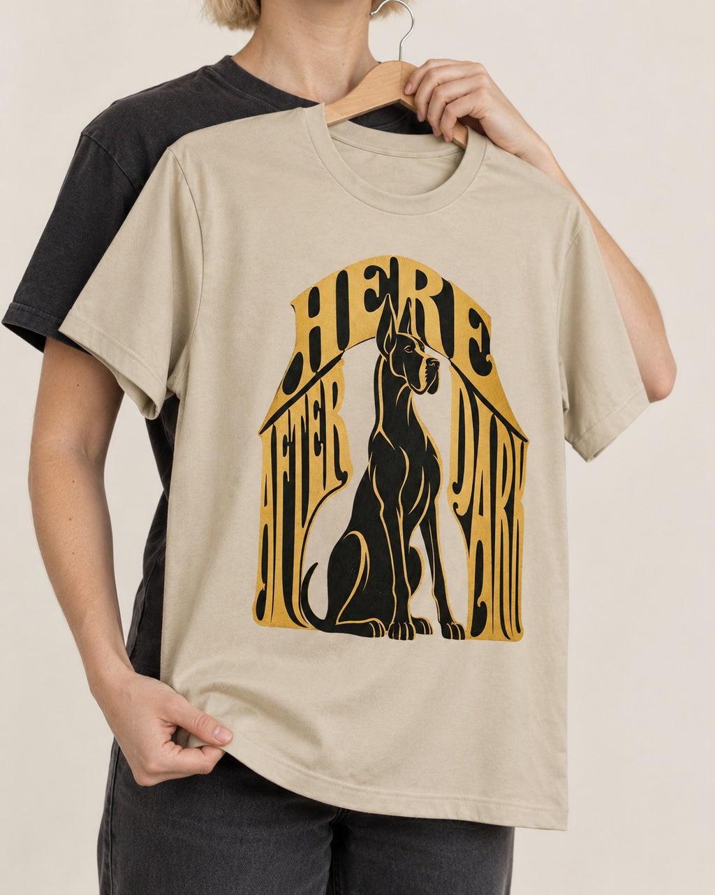 Great Dane Here After Dark T-Shirt in Sand, held up on a hanger