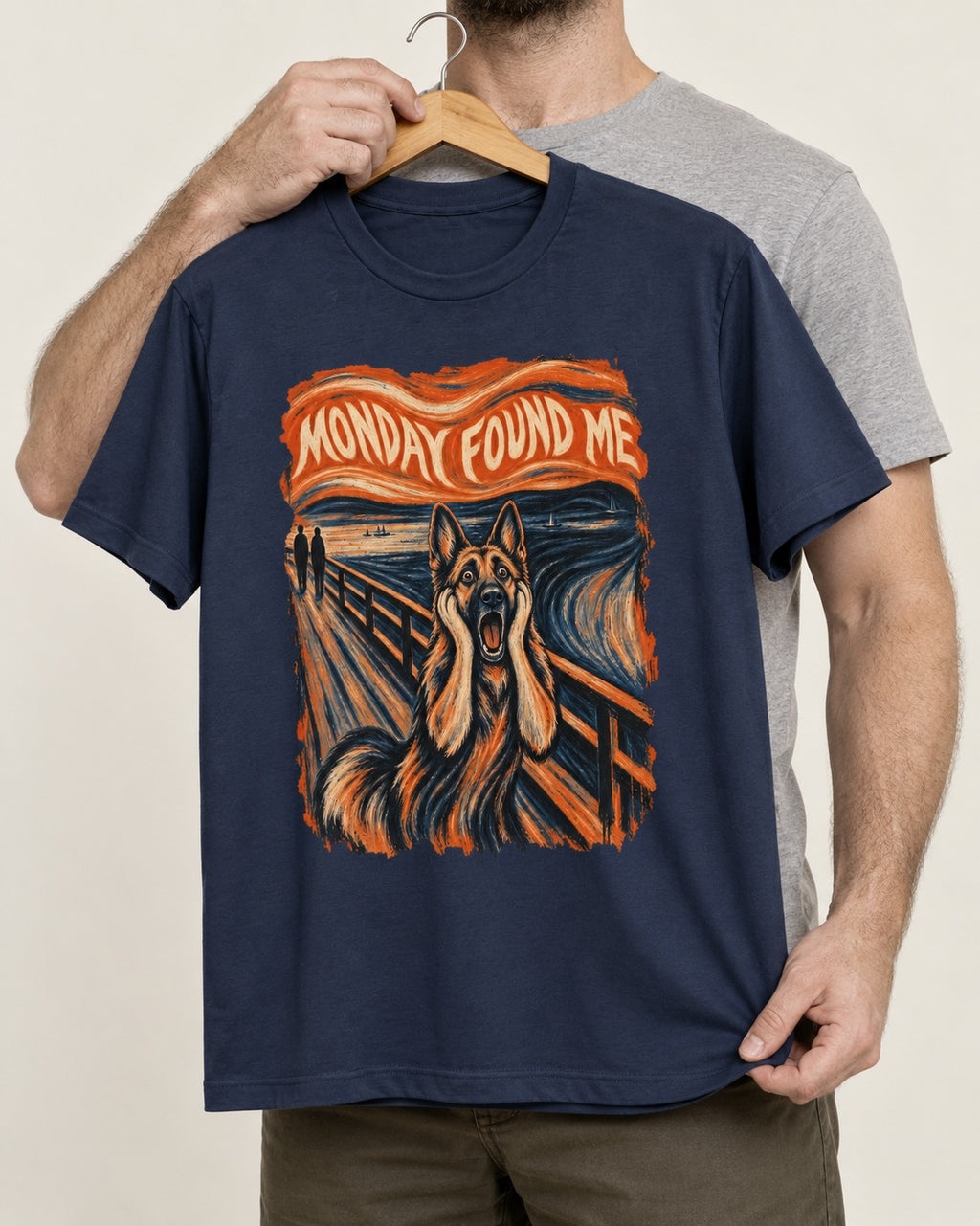 German Shepherd Dog Monday Found Me Scream Graphic T-Shirt in Navy, held up on a hanger