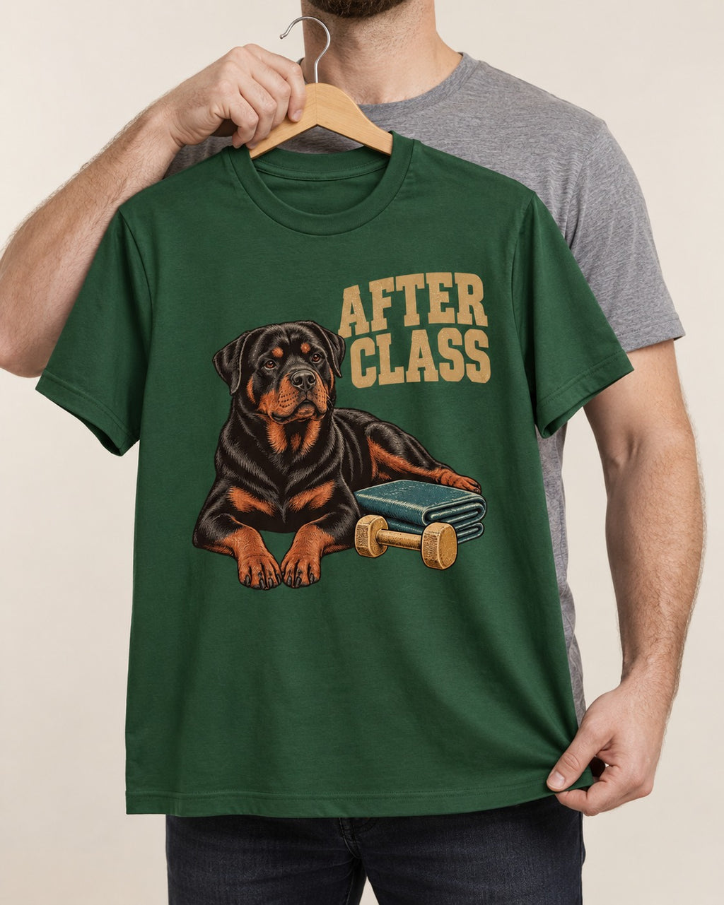 Rottweiler After Class Books and Dumbbell Graphic T-Shirt in Forest Green, held up on a hanger