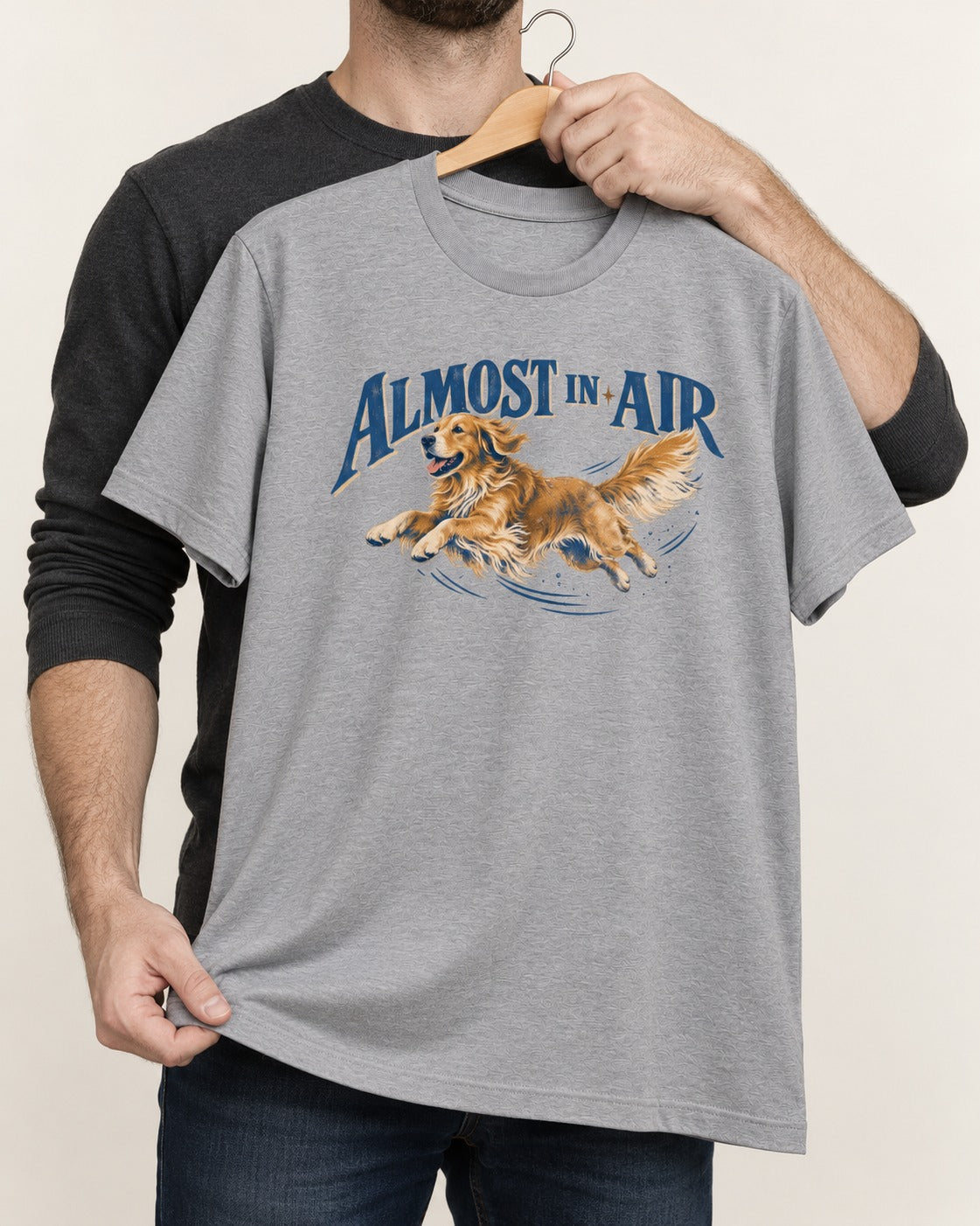 Golden Retriever Almost in Air Flying Graphic T-Shirt in Sport Grey, held up on a hanger