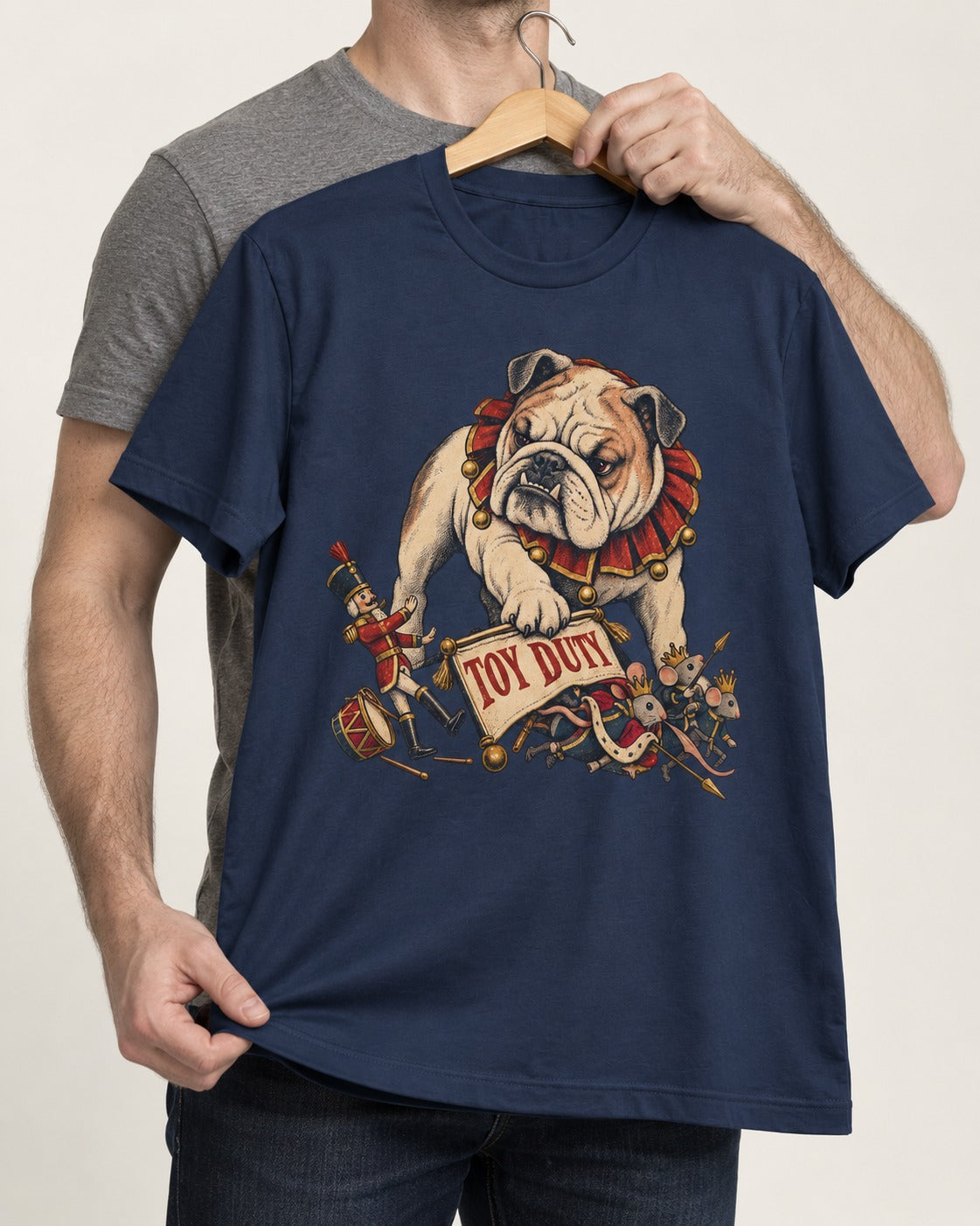 English Bulldog Toy Duty Nutcracker Mice T-Shirt in Navy, held up on a hanger