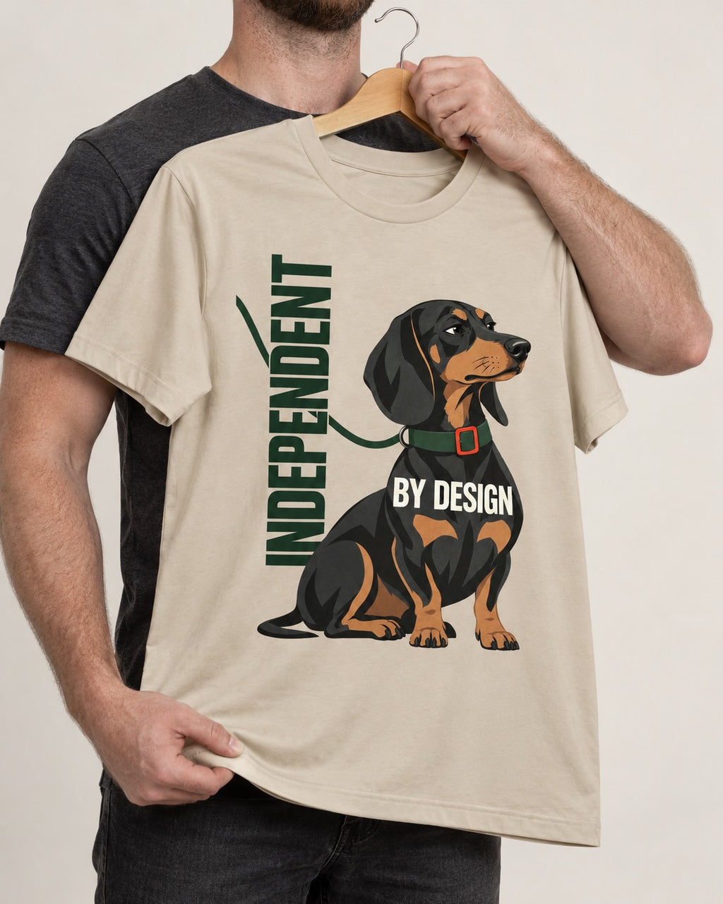 Independent Dachshund T-Shirt in Sand, held up on a hanger