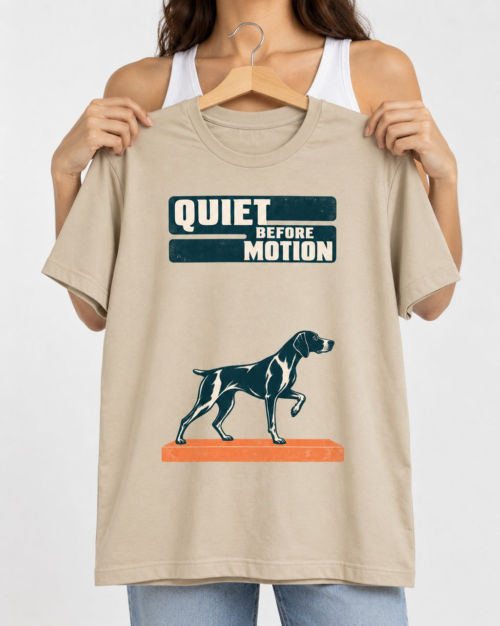Quiet Before Motion German Shorthaired Pointer T-Shirt in Sand, held up on a hanger