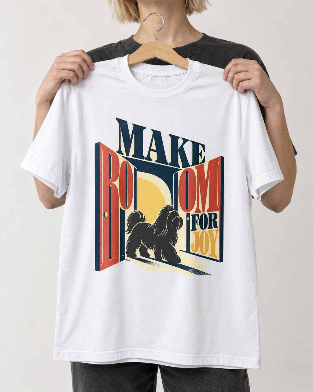 Shih Tzu Make Room for Joy Doorway Graphic T-Shirt in White, held up on a hanger