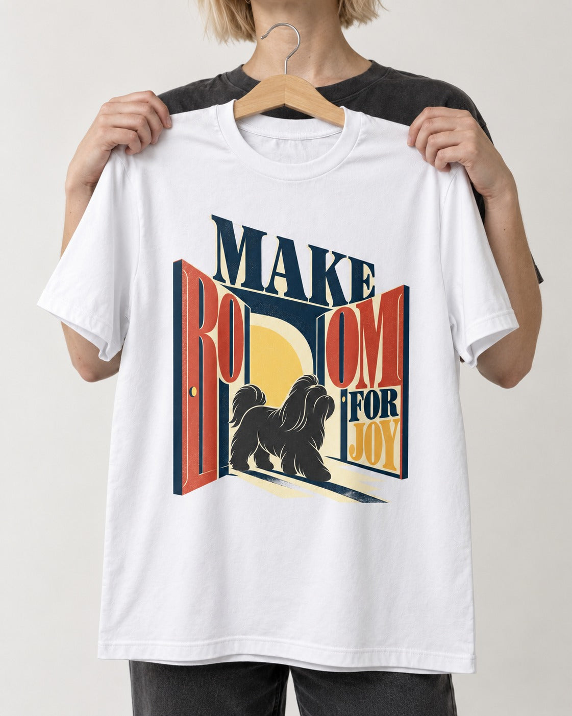 Shih Tzu Make Room for Joy Doorway Graphic T-Shirt in White, held up on a hanger
