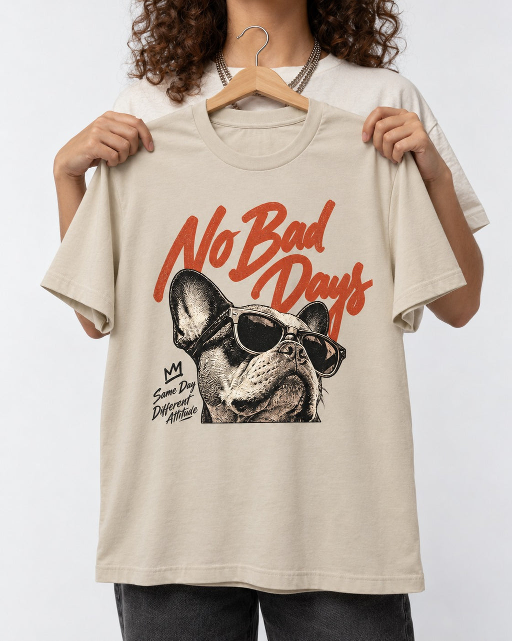 Frenchie No Bad Days T-Shirt in Sand, held up on a hanger