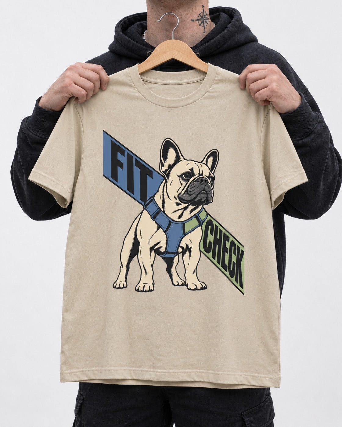 Frenchie Fit Check T-Shirt in Sand, held up on a hanger