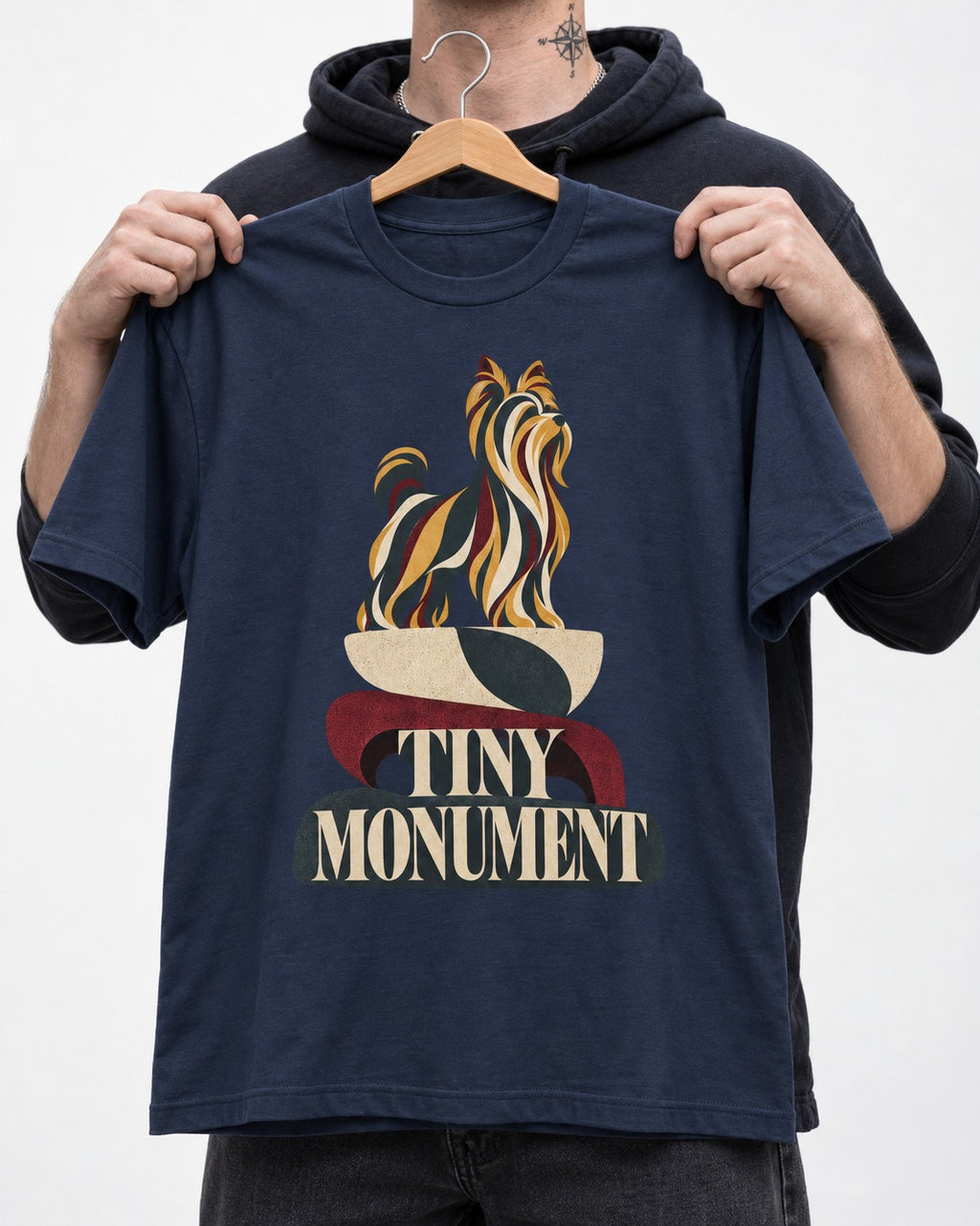 Yorkshire Terrier Tiny Monument Sculptural Plinth Graphic T-Shirt in Navy, held up on a hanger