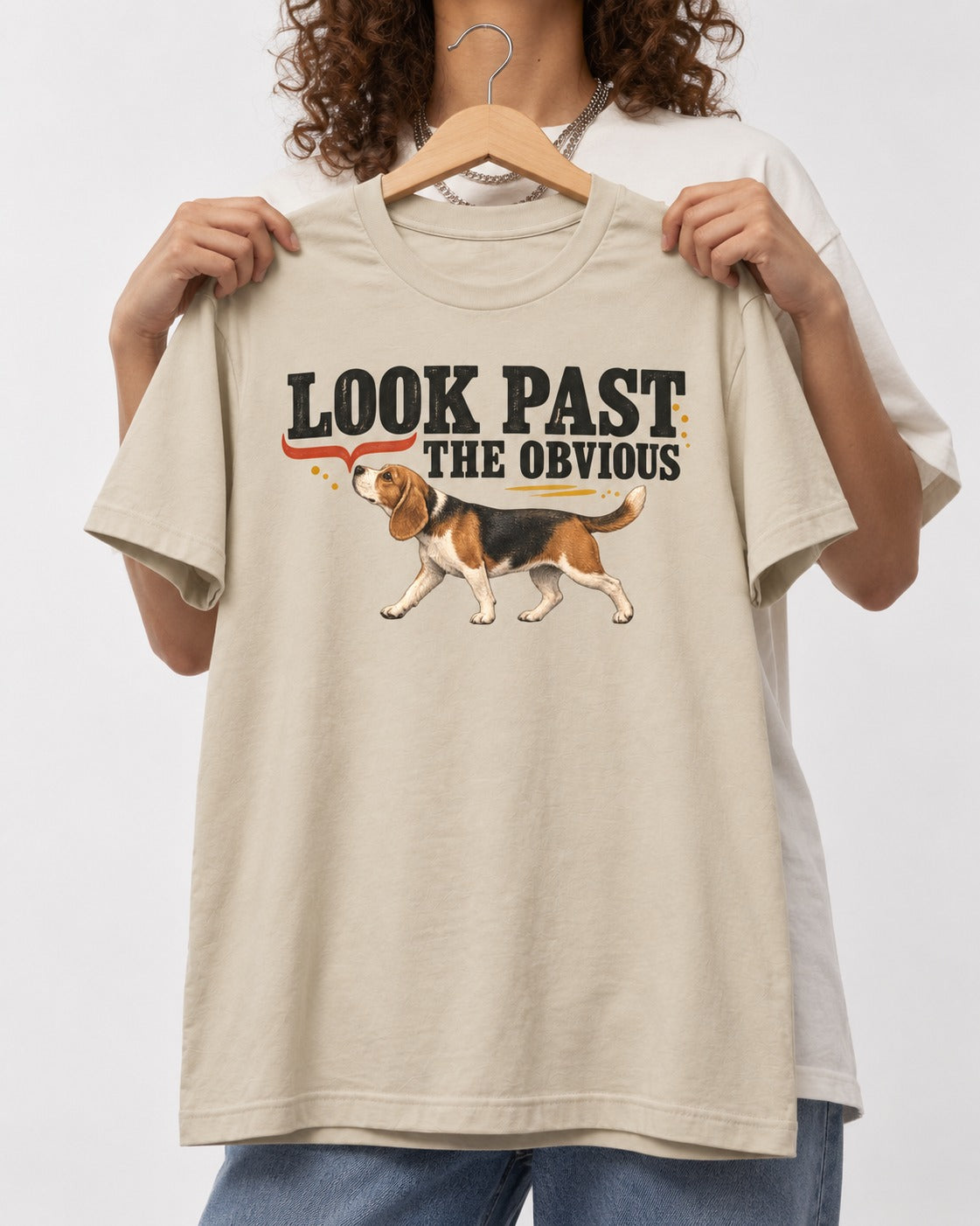 Beagle Look Past the Obvious T-Shirt in Sand, held up on a hanger