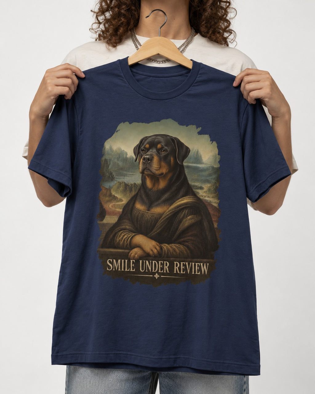Rottweiler Smile Under Review Renaissance Portrait Graphic T-Shirt in Navy, held up on a hanger