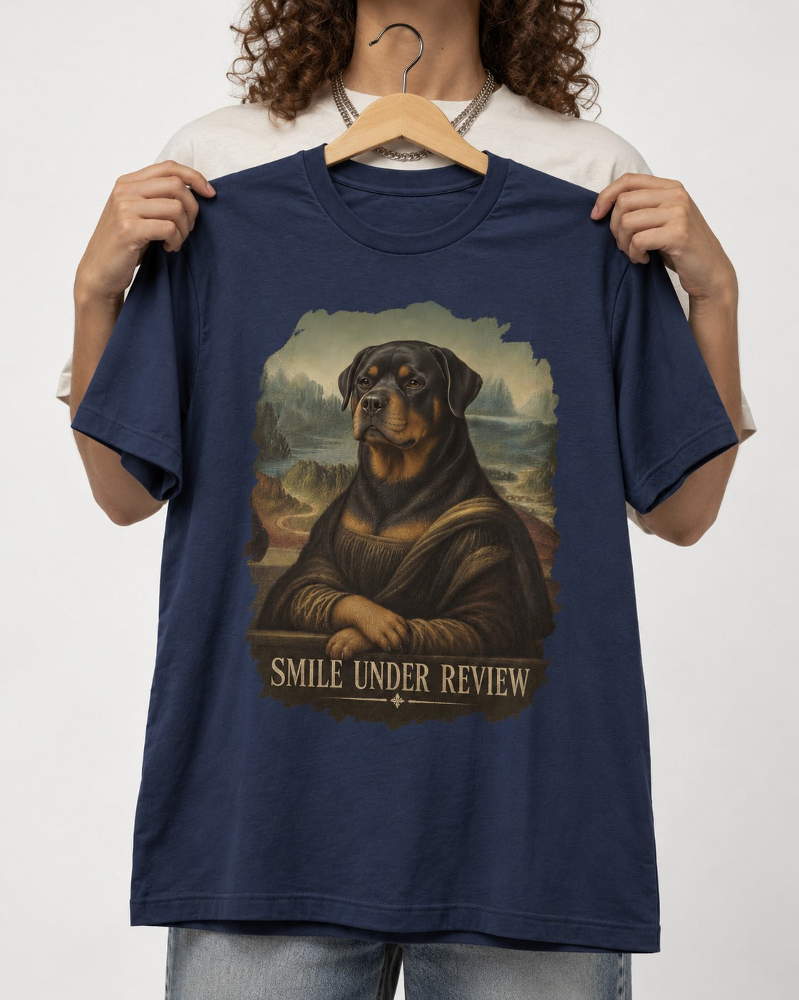 Rottweiler Smile Under Review Renaissance Portrait Graphic T-Shirt in Navy, held up on a hanger