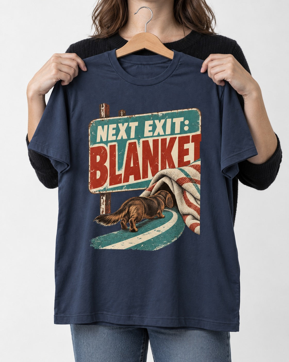 Dachshund Next Exit Blanket Road Sign Graphic T-Shirt in Navy, held up on a hanger
