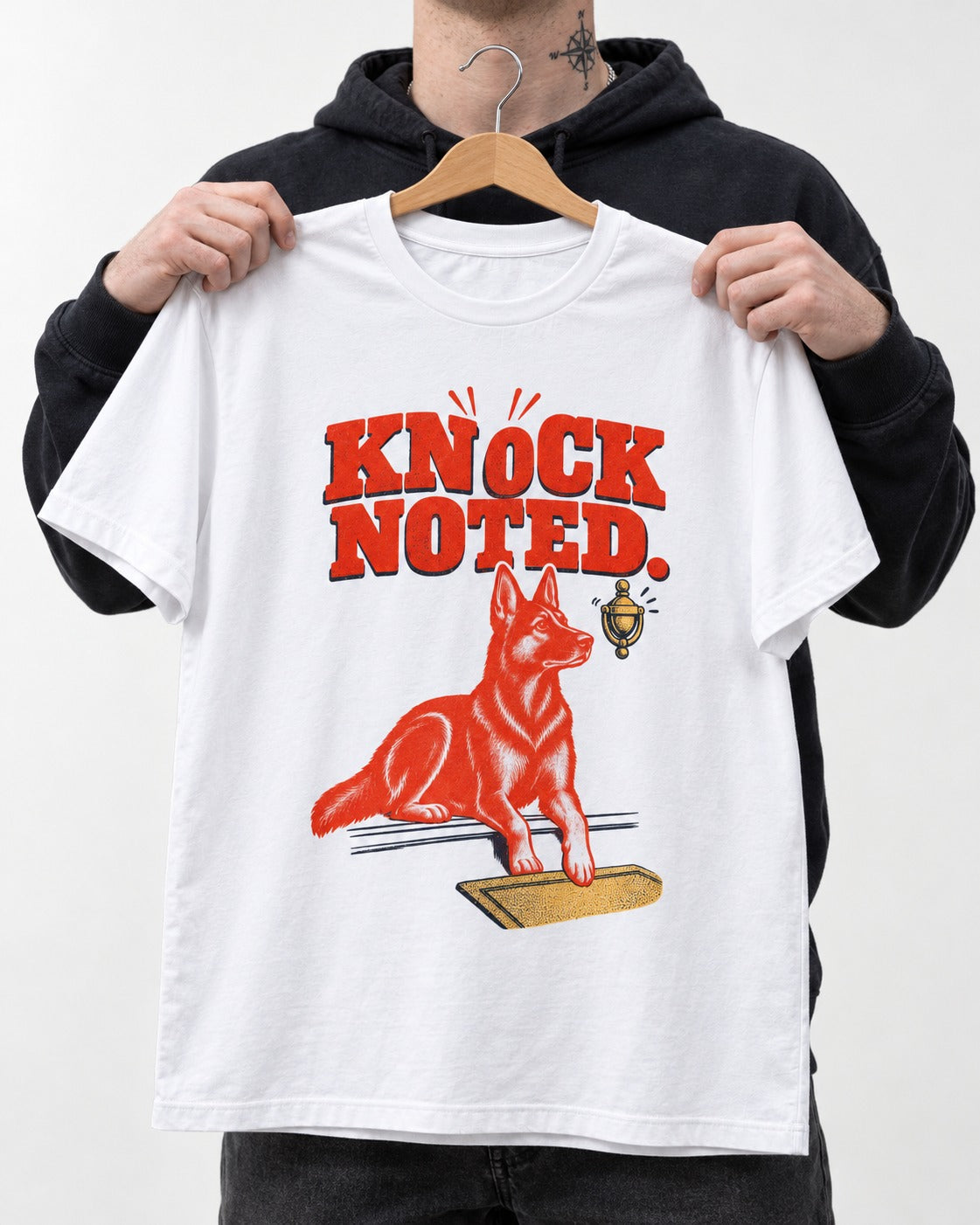 Knock Noted Door Knocker German Shepherd Dog Graphic T-Shirt in White, held up on a hanger