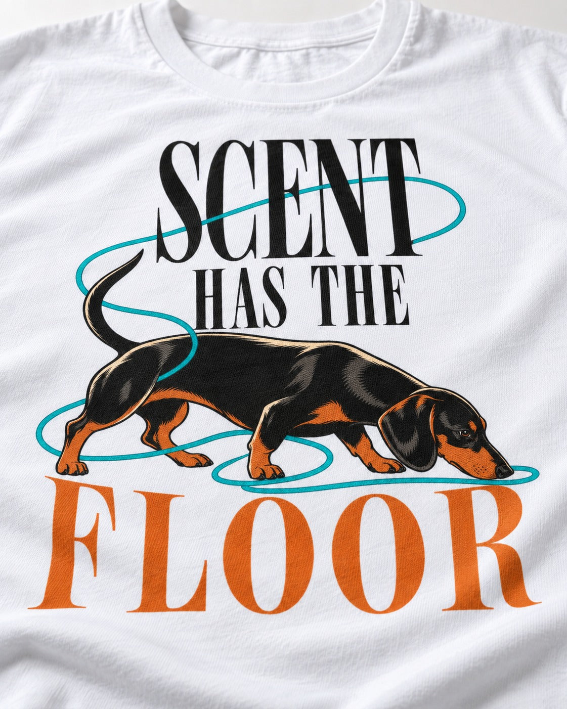 Dachshund Scent Has the Floor T-Shirt in White, close-up of the graphic