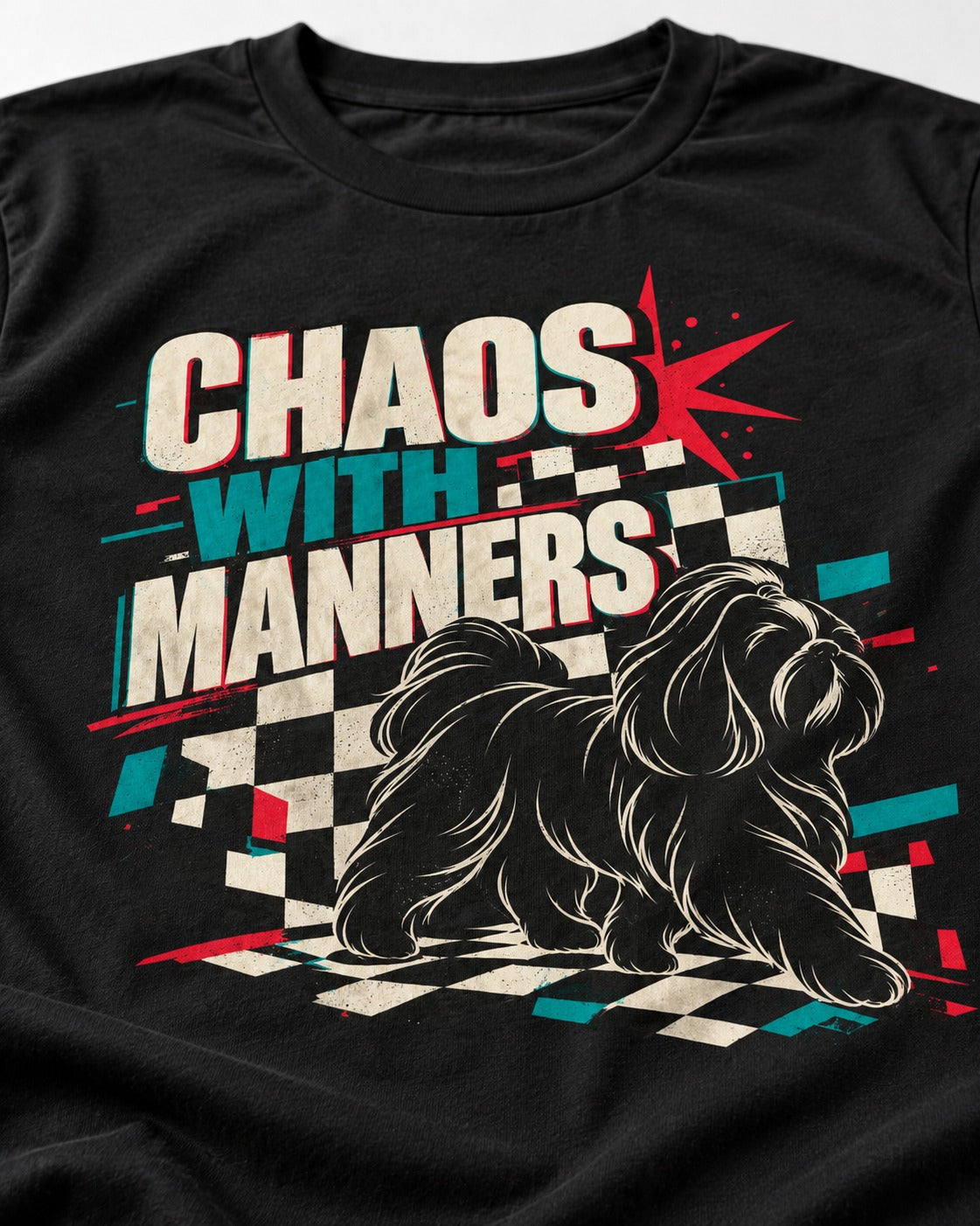 Shih Tzu Chaos with Manners Checkerboard Graphic T-Shirt in Black, close-up of the graphic