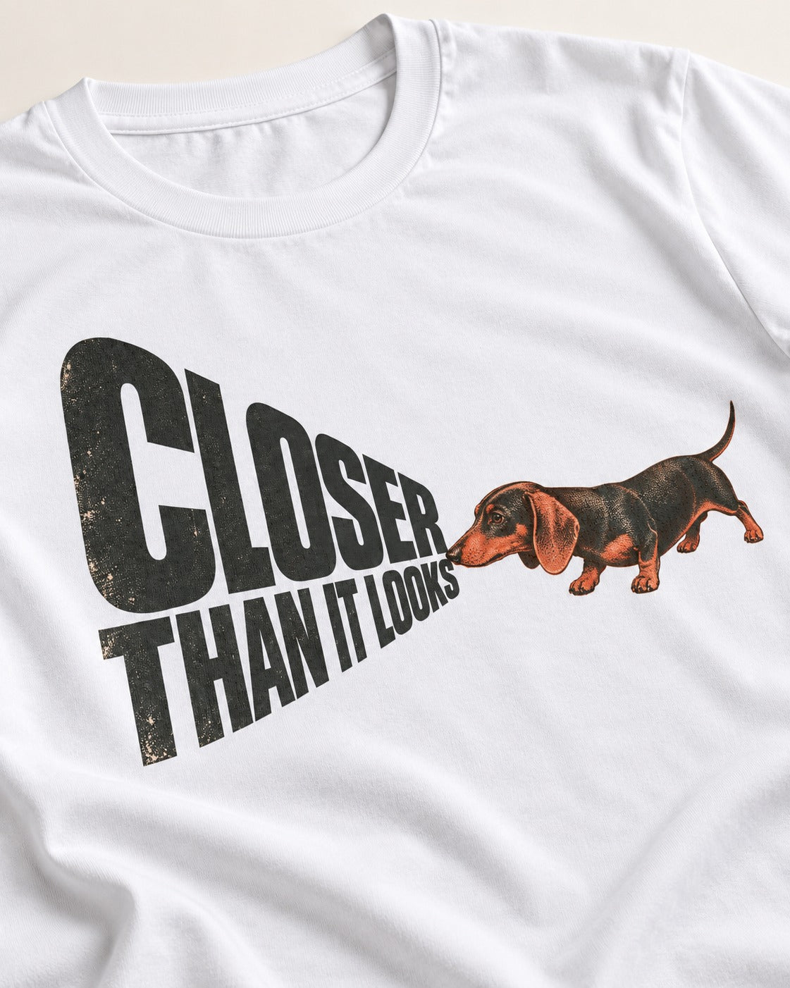 Dachshund Closer Than It Looks T-Shirt in White, close-up of the graphic