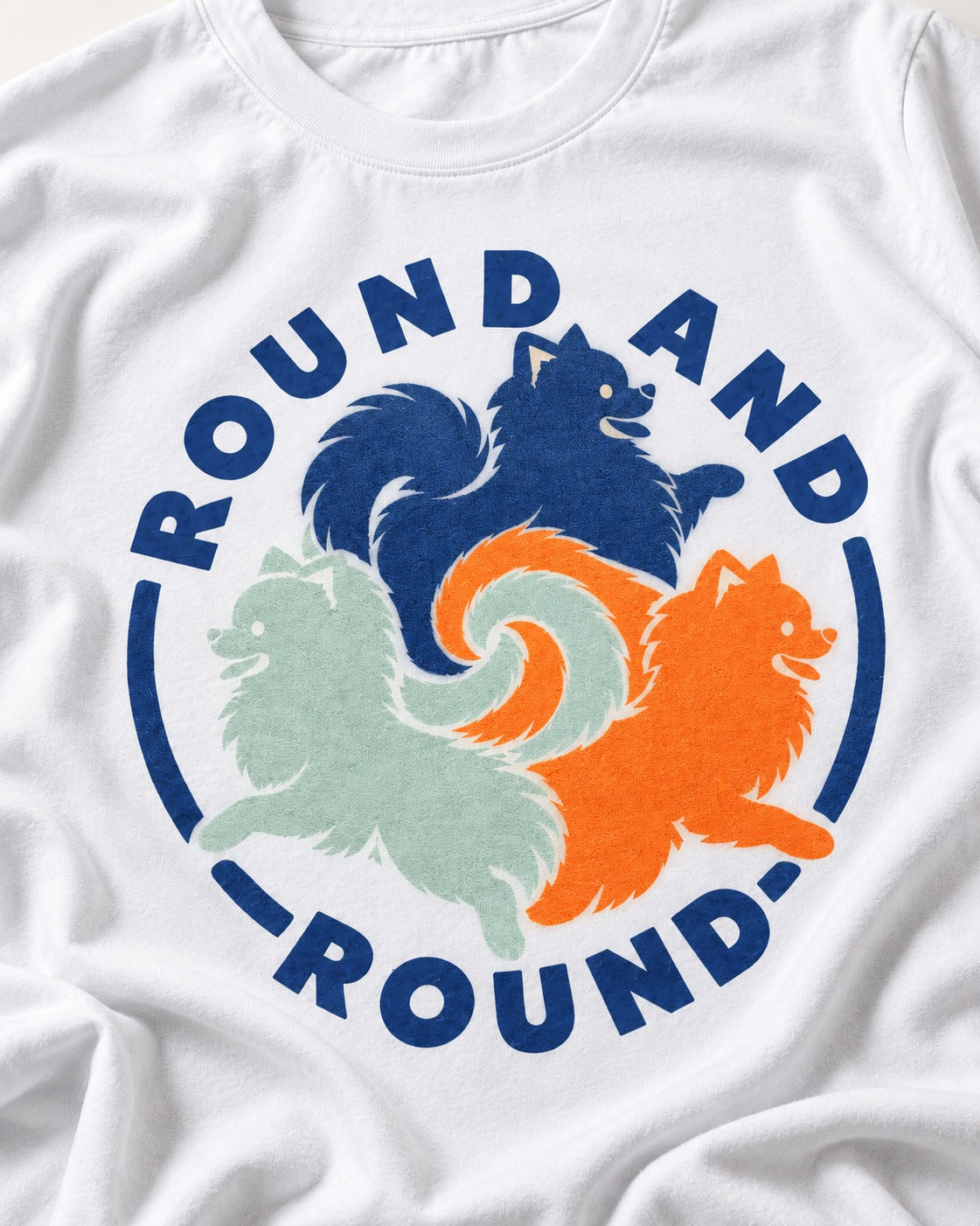 Pomeranian Round and Round T-Shirt in White, close-up of the graphic