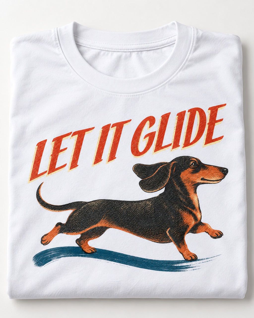 Let It Glide Dachshund T-Shirt in White, close-up of the graphic
