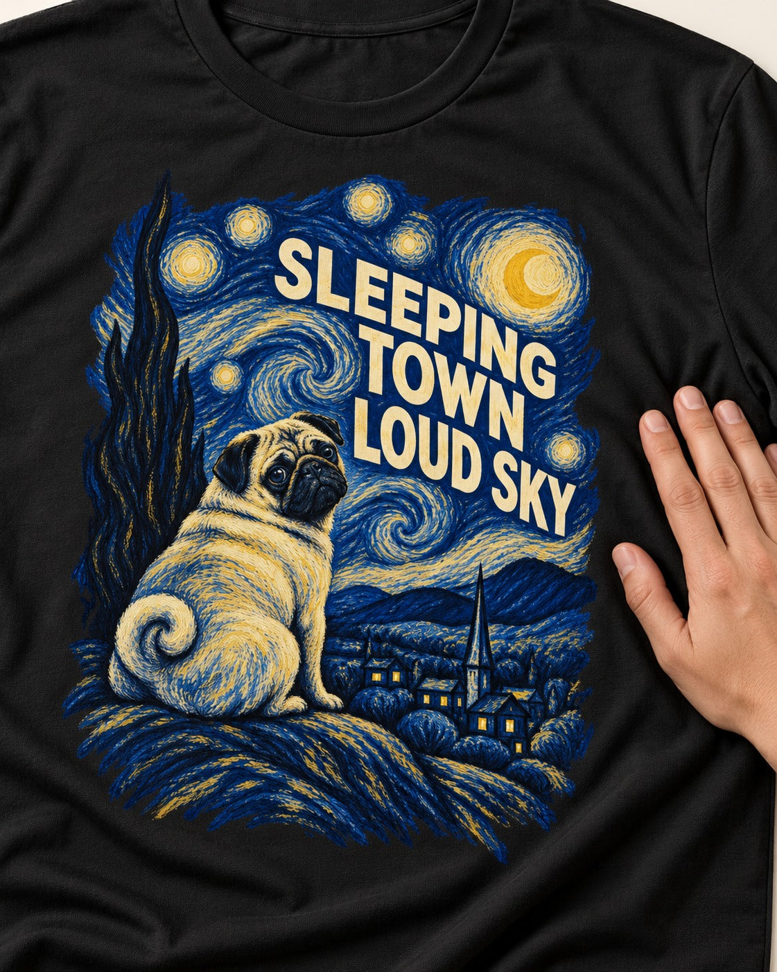 Pug Sleeping Town Loud Sky Starry Night Graphic T-Shirt in Black, close-up of the graphic