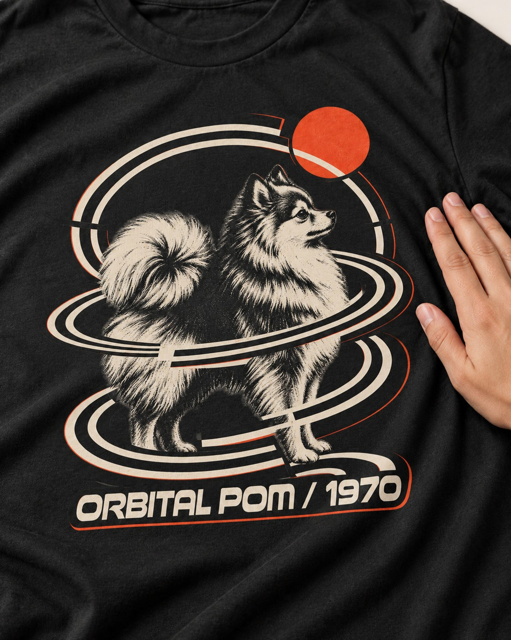 Pomeranian Orbital Pom 1970 Space Age Graphic T-Shirt in Black, close-up of the graphic