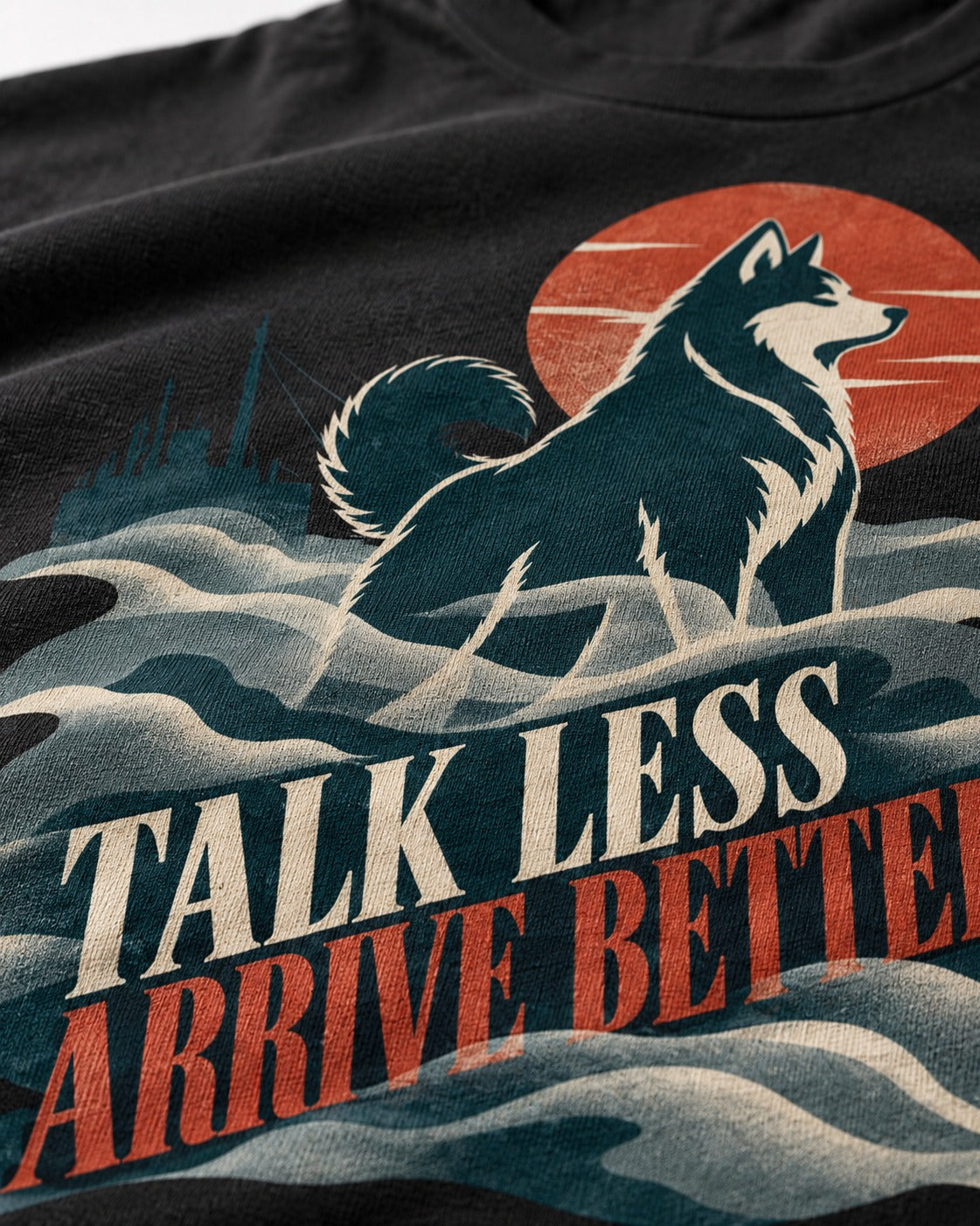 Husky Talk Less Arrive Better Harbor Wave Graphic T-Shirt in Black, close-up of the graphic