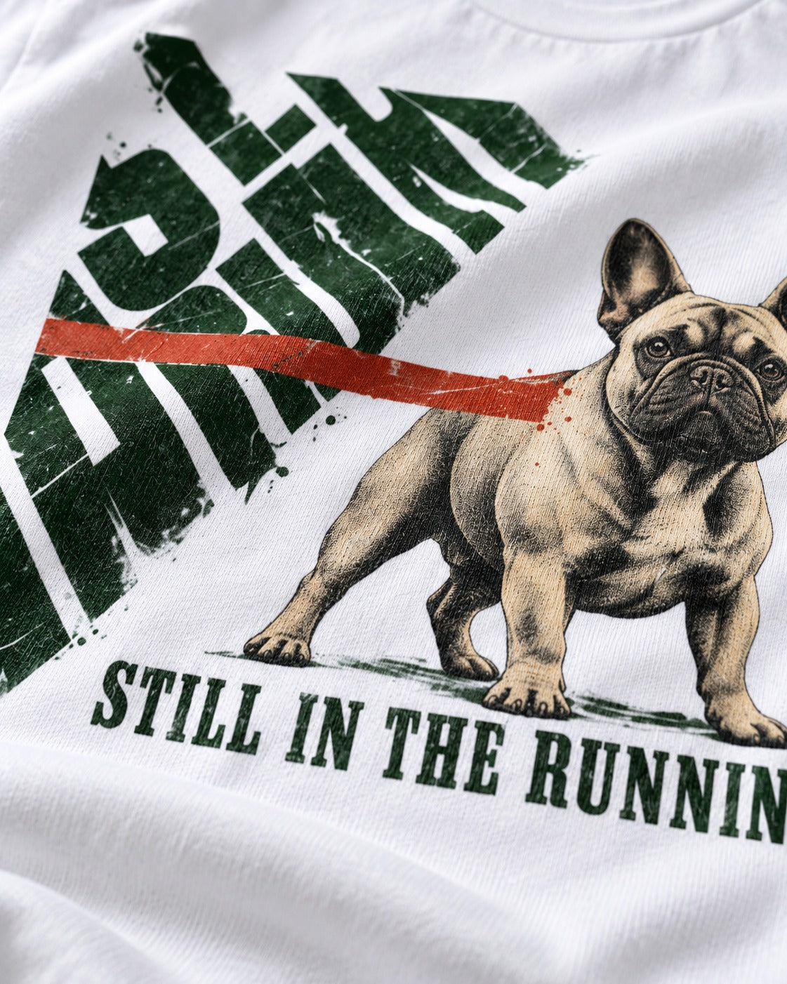 Frenchie Still in the Running T-Shirt in White, close-up of the graphic