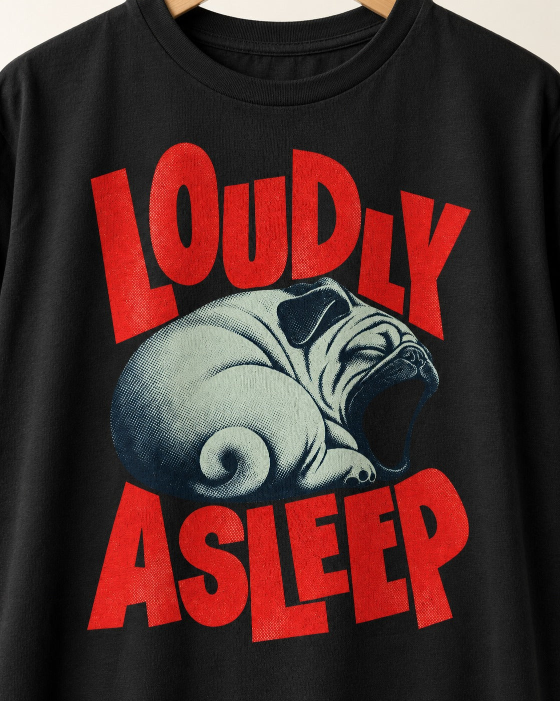 Pug Loudly Asleep Curled Yawn Graphic T-Shirt in Black, close-up of the graphic