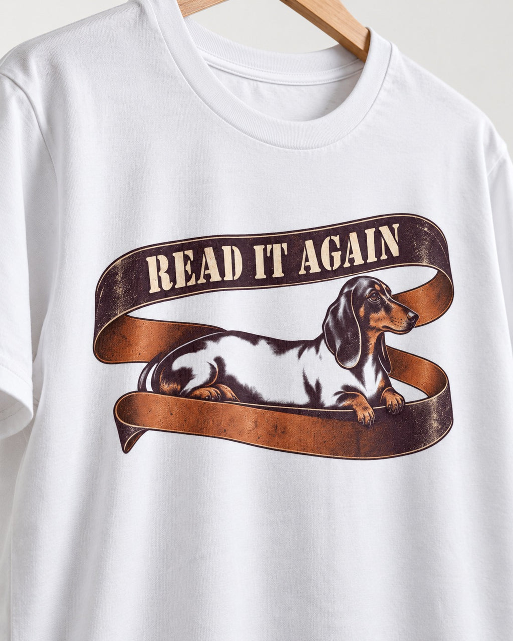 Read It Again Dachshund T-Shirt in White, close-up of the graphic