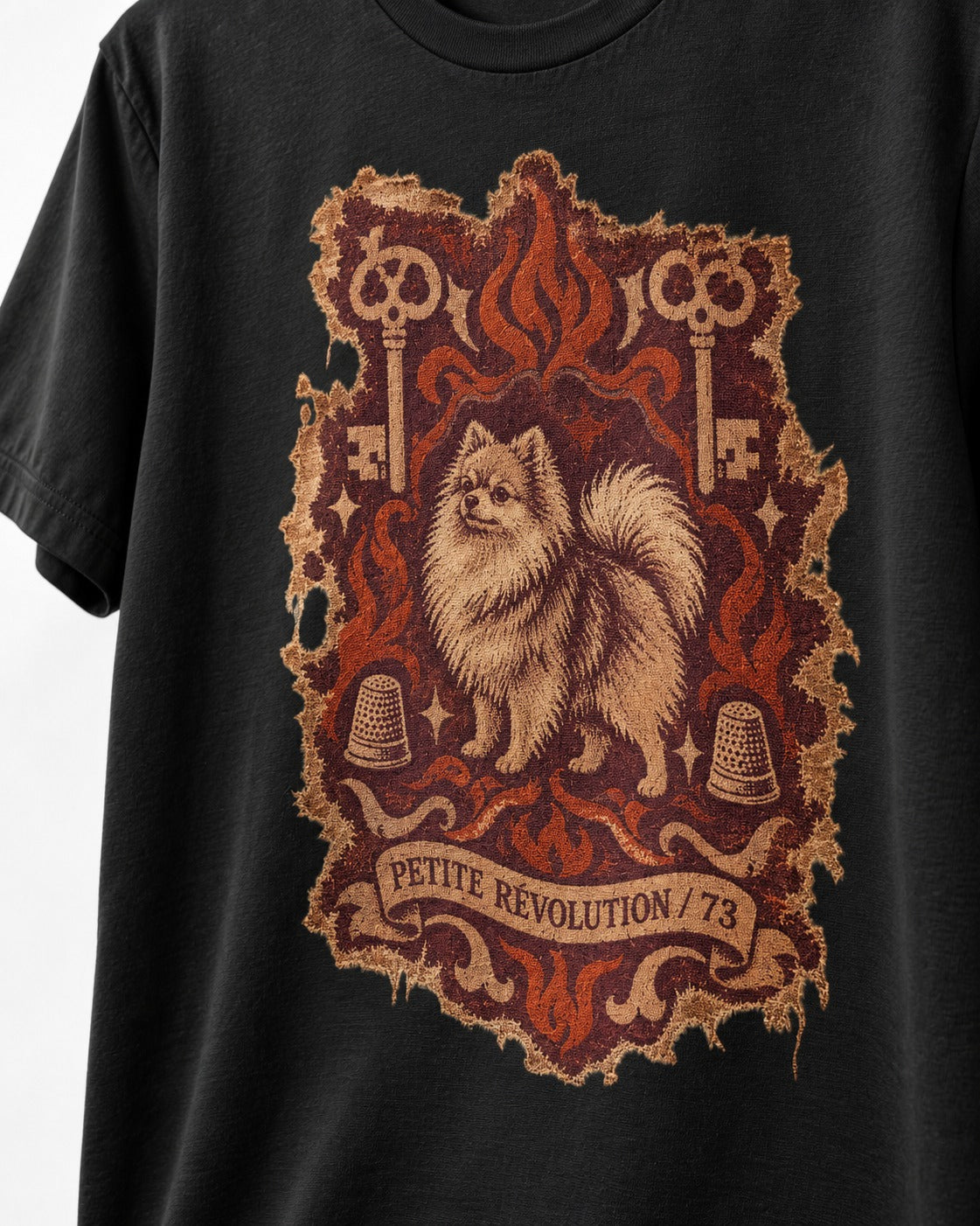 Pomeranian Petite Revolution Ornate Key Emblem Graphic T-Shirt in Black, close-up of the graphic