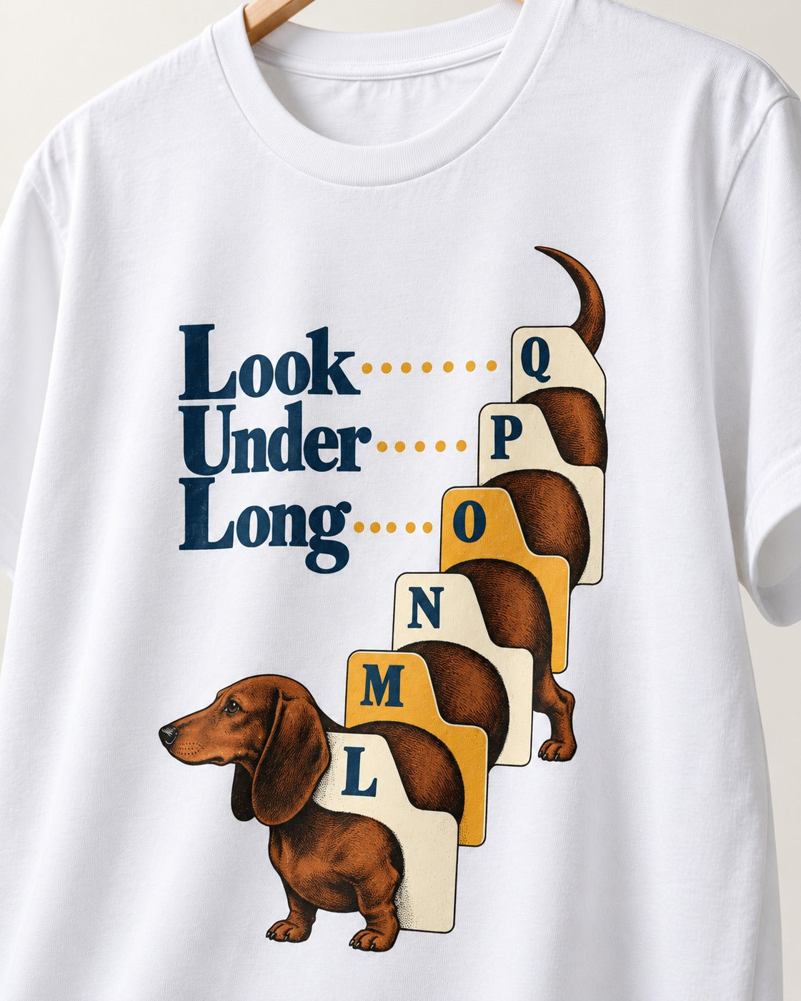 Look Under Long Dachshund T-Shirt in White, close-up of the graphic